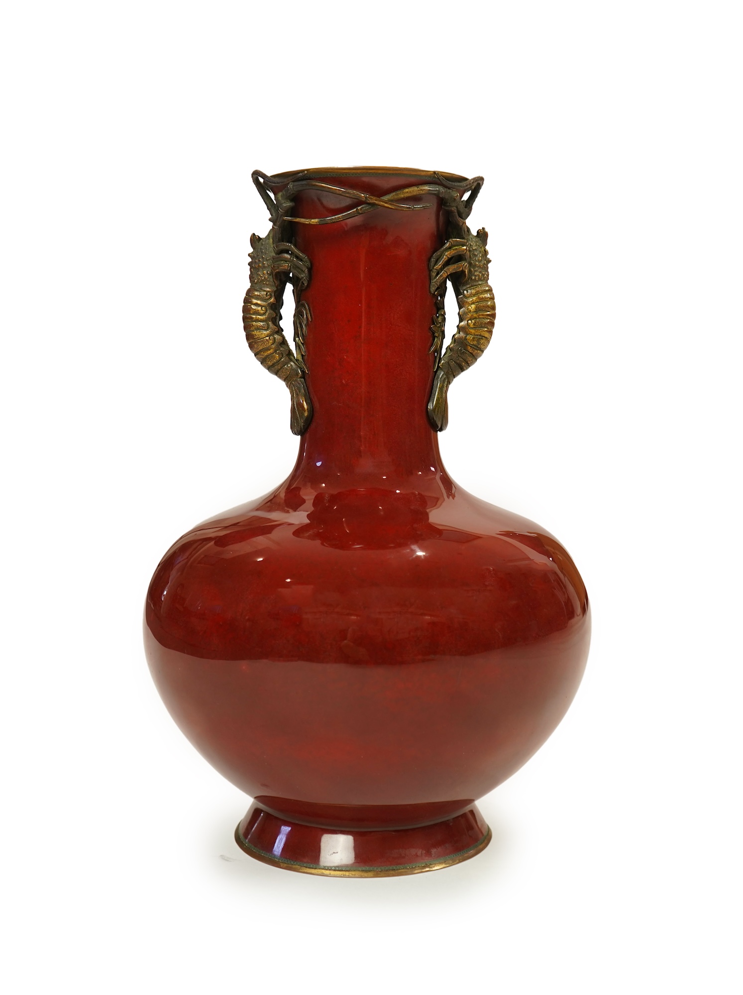 An unusual Japanese sang-de-boeuf ground cloisonné enamel and gilt metal mounted vase